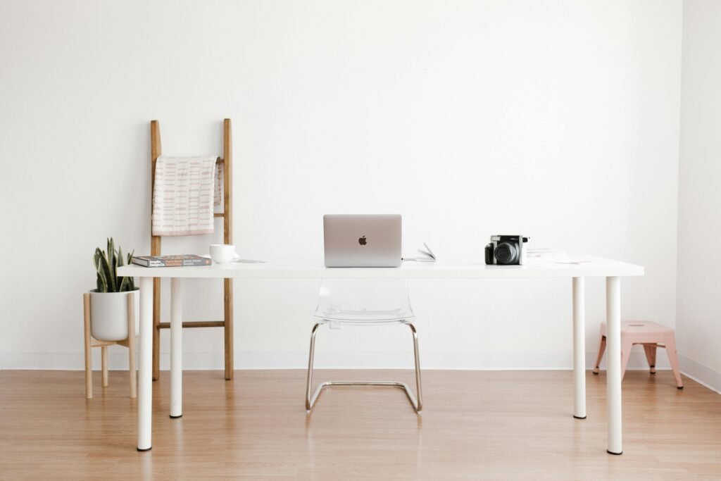 Working studio with chair, desk, laptop